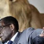 mugabe-rejecting-something_600x384